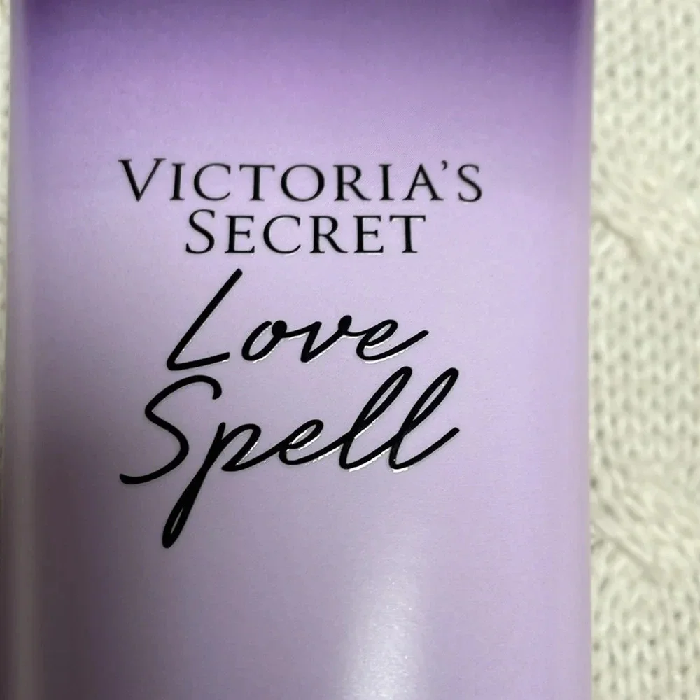 NWOT Victoria Secret Love Spell Body Lotion. 8oz. Purple tube cherry/peach smell
